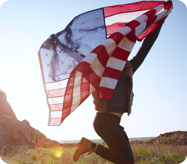 Person jumping with American flag